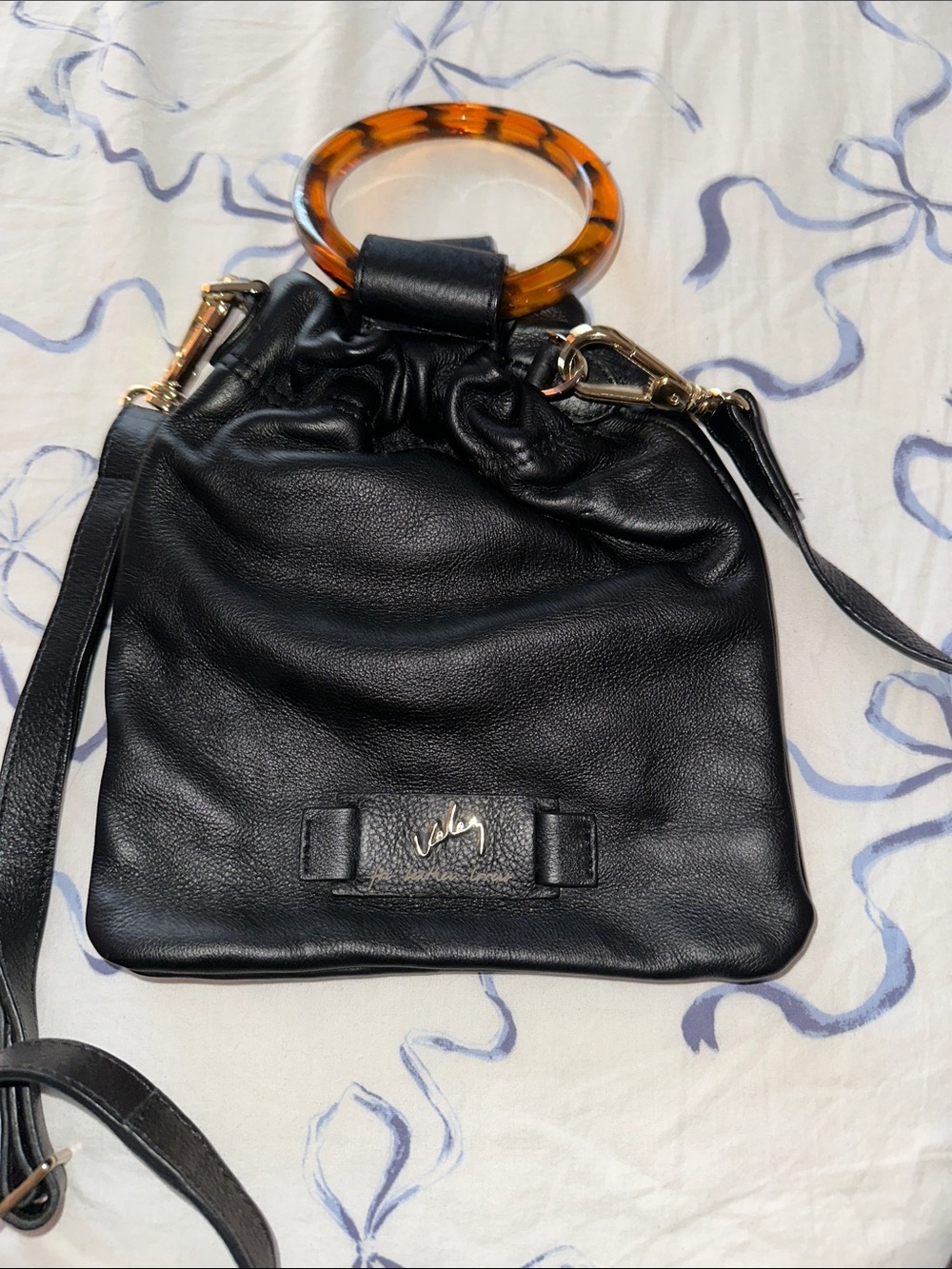 Black Leather Drawstring Handbag with Tortoiseshell Ring Handle